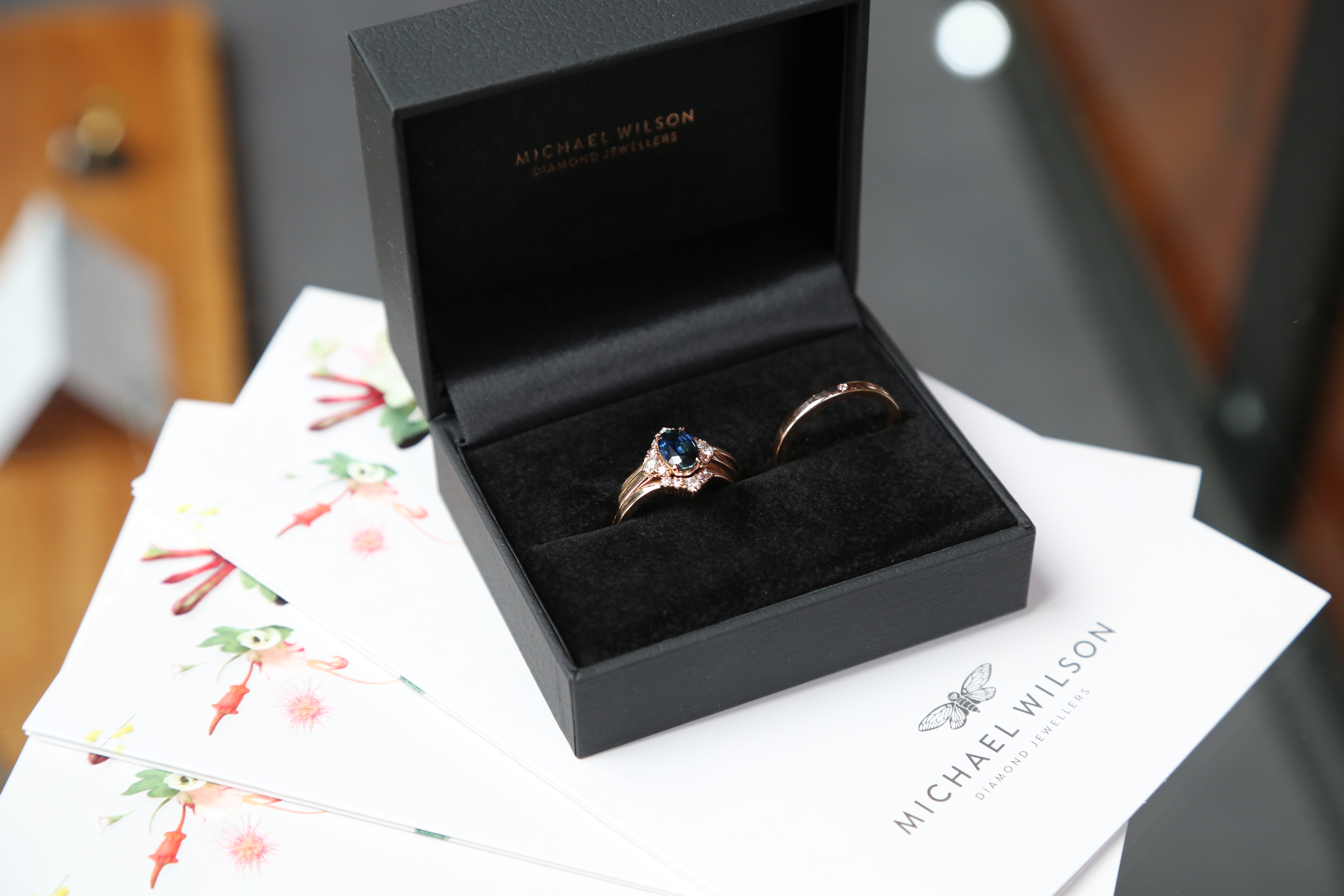 Seven stone engagement ring, oval blue sapphire and side pink and white diamonds. Fitted contoured wedding ring set. Eltham jeweller, Melbourne, Australia