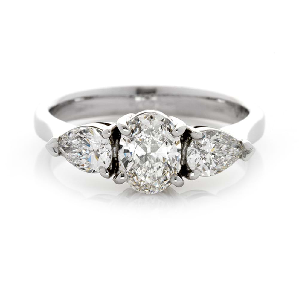 Three stone diamond engagement ring with oval centre stone and side pears, beautiful rings, Melbourne Australia, trilogy rings
