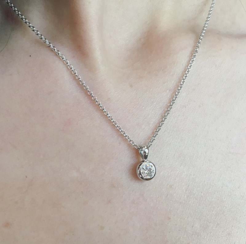 Model wearing bezel set diamond pendant in white gold, everyday jewellery, Melbourne Australia