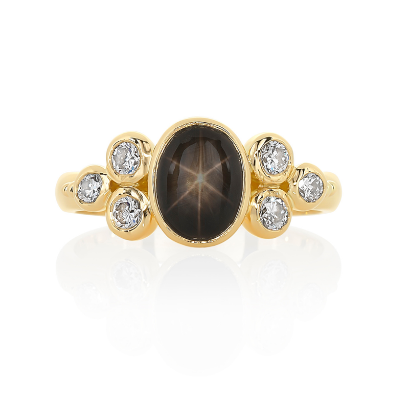 Black star sapphire ring with side cluster of diamonds in yellow gold, Melbourne 