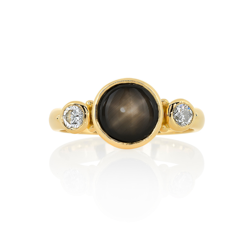 Round black star sapphire with side diamonds bezel set in yellow gold, Melbourne Australia, trilogy rings, Eltham jeweller