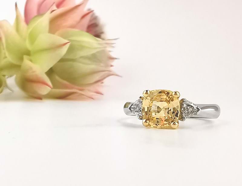 Golden yellow cushion sapphire with side trillion diamonds, ring, Melbourne Australia, trilogy rings, trilogy engagement rings