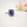 Grain set Alice blue sapphire ring in white gold with diamond halo and diamond shoulders, Melbourne Australia