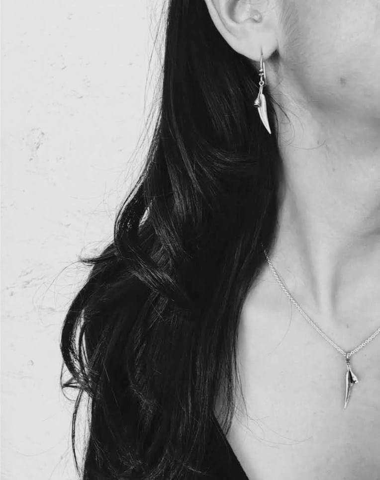 Model wearing sterling silver gumleaf and nut design pendant on chain and matching earrings, jewellery, Australiana, gifts, souvenirs, Australia