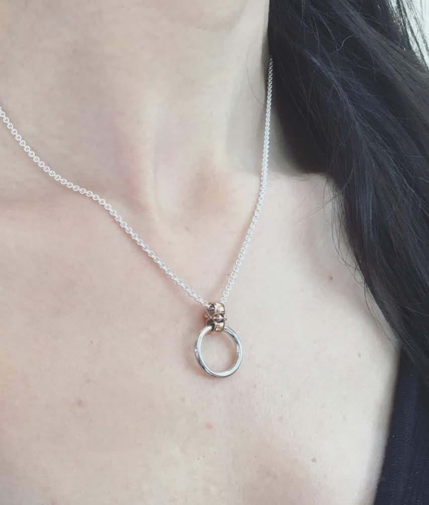 Model wearing two-tone circle pendant on chain, circle pendant jewellery, Melbourne Australia