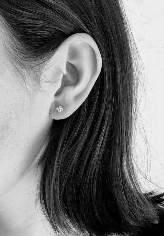 dainty diamond flower stud earring on model, Melbourne Australia