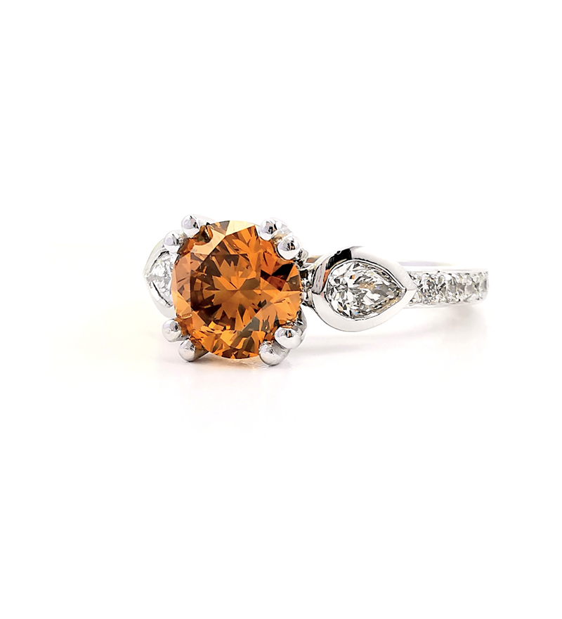 Orange natural coloured diamond ring with side pear diamonds and diamond shoulders, Melbourne Australia, Eltham jewellers, Melbourne jewellers, rare coloured diamonds, fancy rings, vintage style rings, engagement rings, wedding anniversary rings, dai
