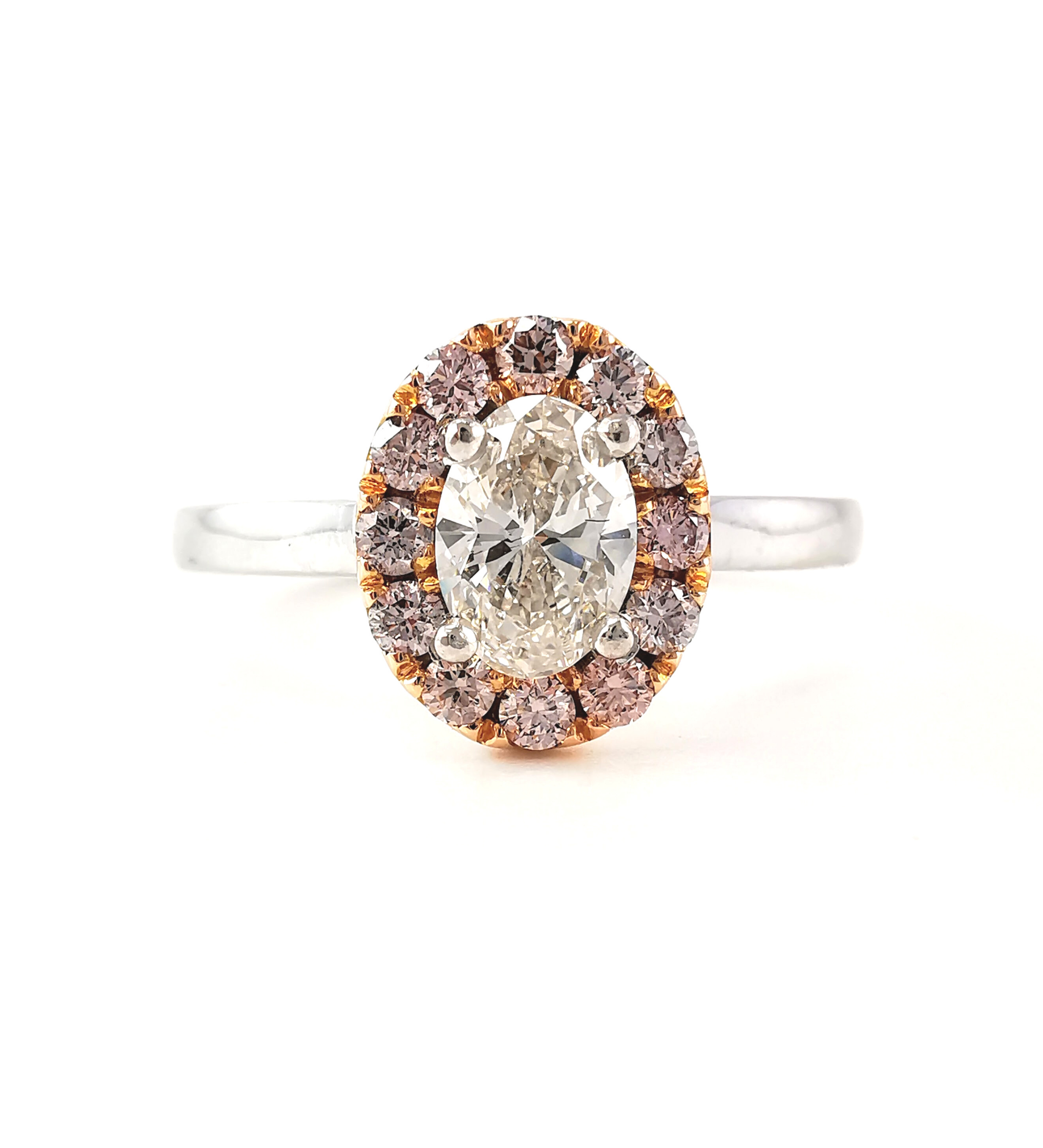 Oval diamond with halo of rare Argyle pink diamonds ring, diamond engagement ring, Melbourne jeweller, Eltham jewellers, Australia, popular engagement rings, oval shape diamond, rare coloured diamonds, rings, engagement ring shopping, engagement ring ideas